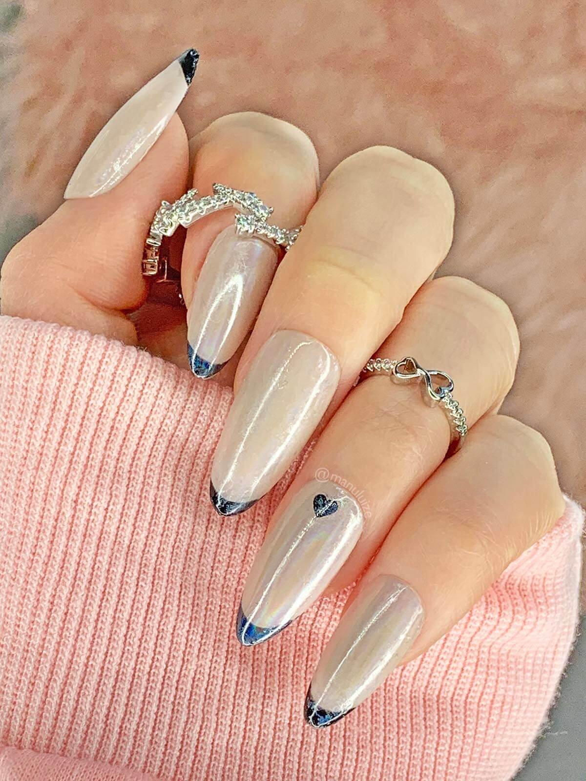 Nude and black French nails with a heart: trendy glossy nails
