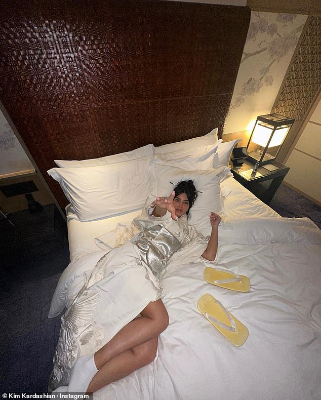 Taking it easy: She was filmed in her hotel room, and she played around on her bed