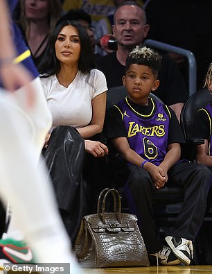 Kim looked to be enjoying the game with Saint West