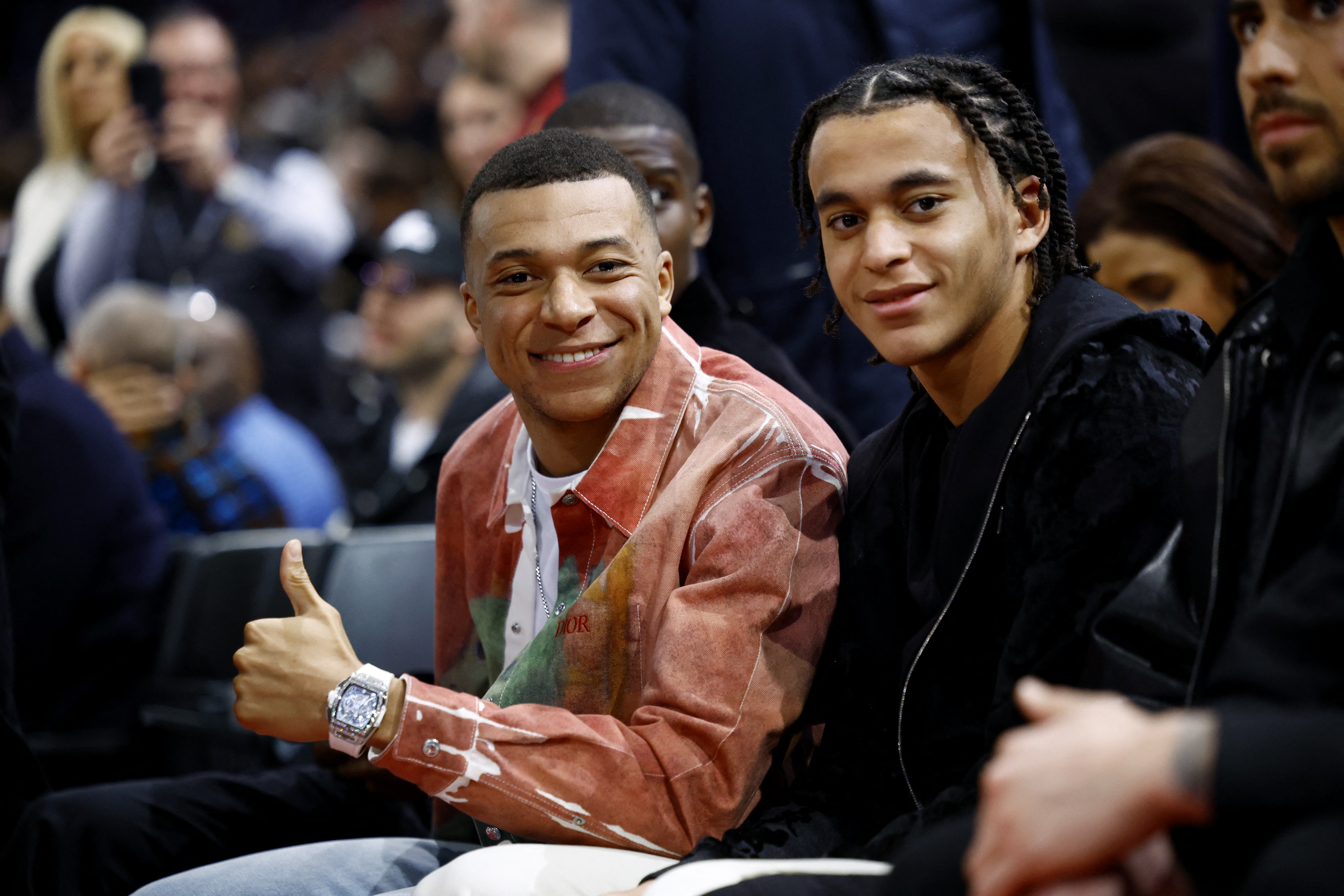 Mbappe, 25, sat next to little brother Ethan