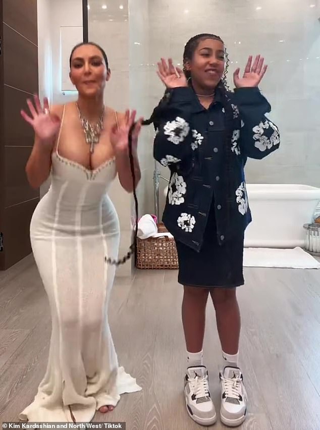 The 43-year-old mogul — whose mom Kris Jenner, 68, hosted a bash — modeled a sexy white dress with a low-cut, studded neckline in a brief TikTok video