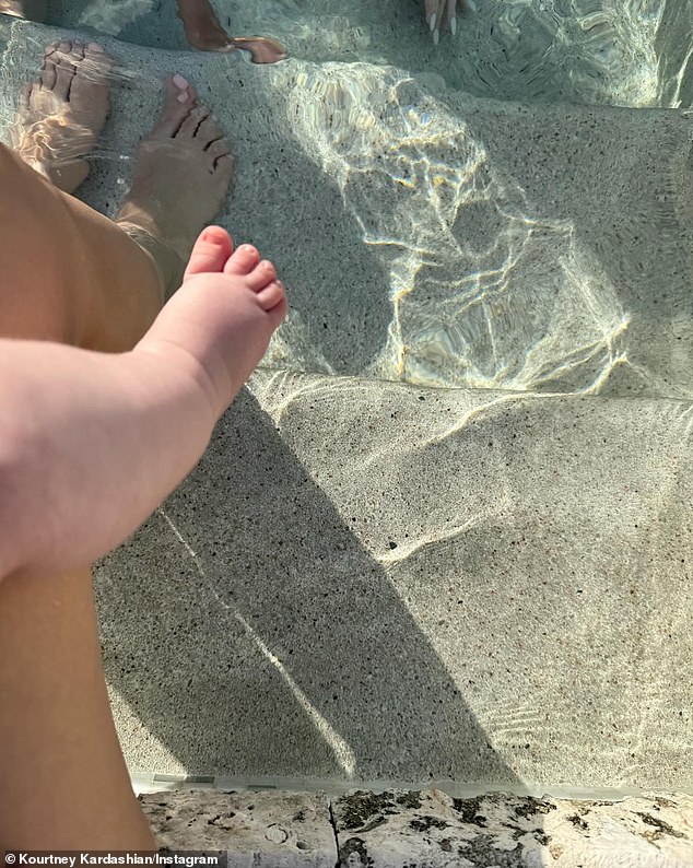 While vacationing with her family, including sisters Kim and Khloé Kardashian, in the Turks and Caicos, the 44-year-old reality star posted an adorable image of her little boy sitting on her lap as they both dipped their feet into the pool