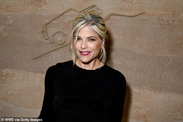 The Cruel Intentions star, 51, wore her bright blonde hair in a messy updo and popped on a bold red lip