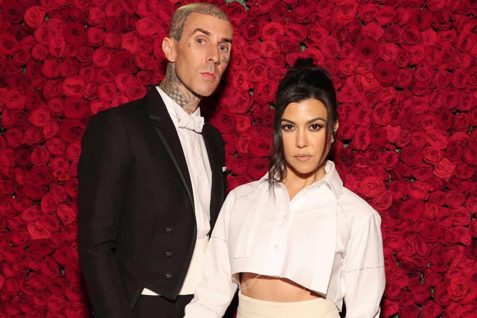 Cindy Ord/MG22/Getty Images for The Met Museum/Vogue Travis Barker and Kourtney Kardashian