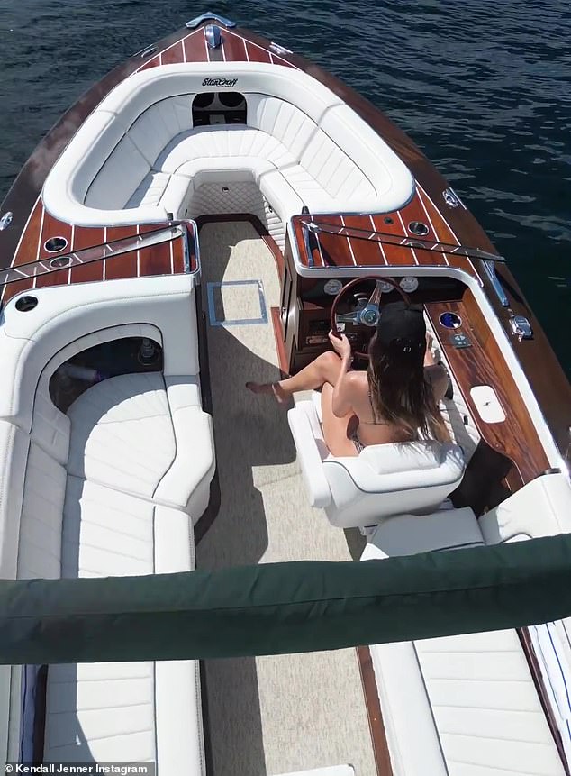 On the water: Jenner also included a video that showed her piloting a boat, which she affectionately referred to as 'my lady'