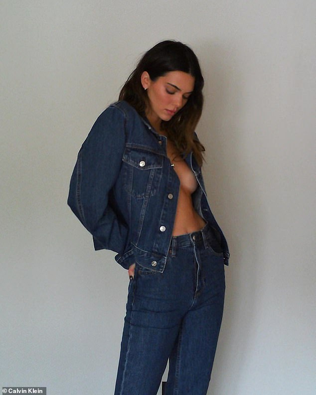 No bra needed? In one set of photos the 27-year-old was seen in a blue denim jacket worn open and jeans that hugged her bottom. But no one was looking at the reality TV star's clothing