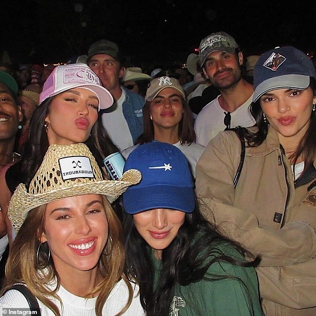 Kendall posed with her entourage as they jammed out to country's greatest hits