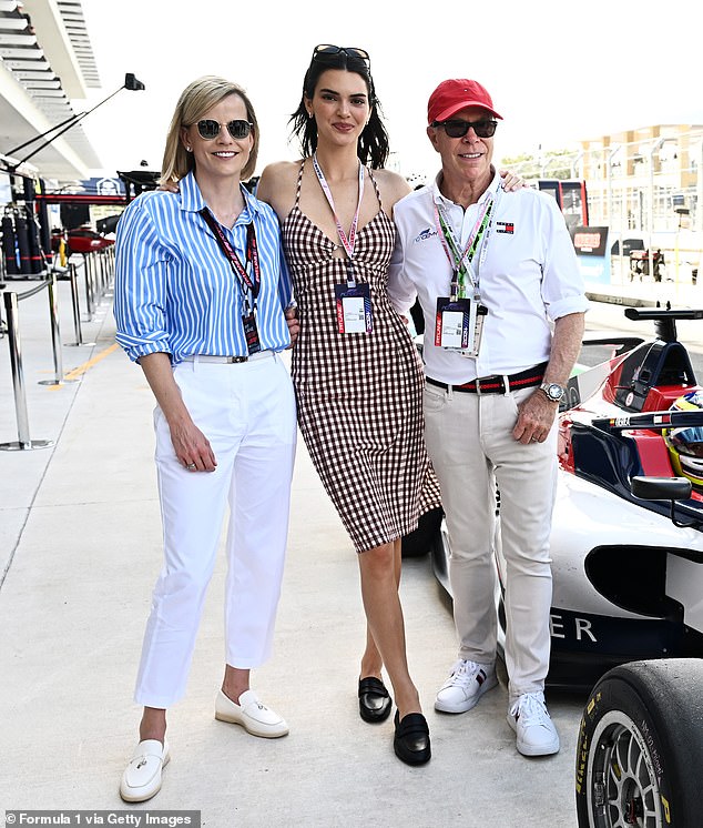 The model spent her time posing up a storm with Tommy Hilfiger and the brand's racecar as an ambassador; pictured with Susie Wolff and Tommy Hilfiger