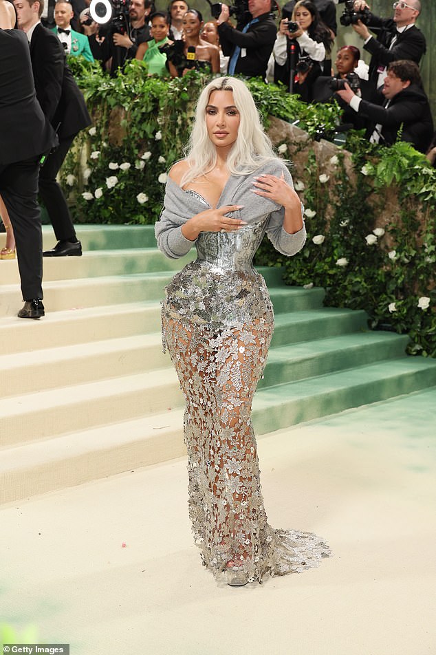 The reality star wowed on the red carpet where she showed off her impossibly slim waist in the silver custom Maison Margiela by John Galliano number
