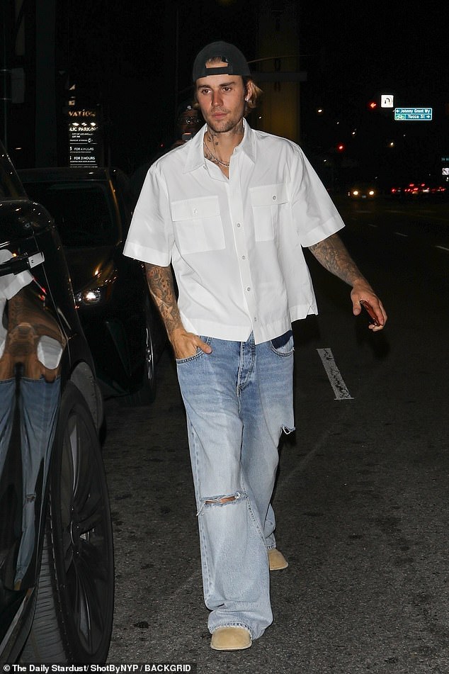 Justin stuck to his usual laidback style as he wore light blue baggy jeans with rips