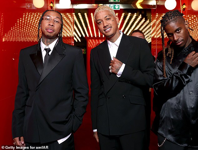 After Akiva introduced Tyga and Edward, he also reportedly shouted out Travis, which seems to have rubbed the Sicko Mode rapper the wrong way; Tyga (far left) and Edwards (middle) seen in Cannes on Thursday