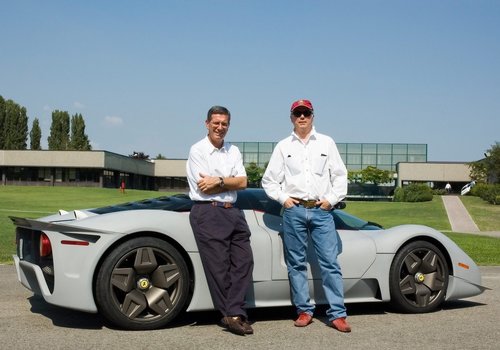 Jim Glickenhaus stands next to Andrea Pininfarina as they lean on white Ferrari