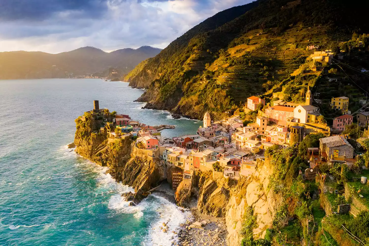 Sunset over the village of Vernazza perched on cliffs, Cinque Terre, La Spezia province, Liguria, Italy