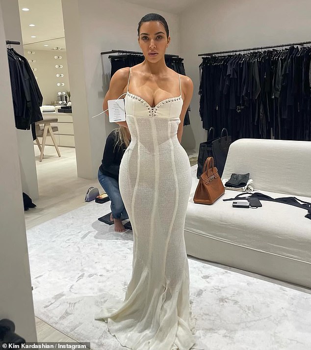 She also turned heads in two sheer white gowns, one featuring a bodice-like silhouette, as she captioned the carousal: 'fitting files'