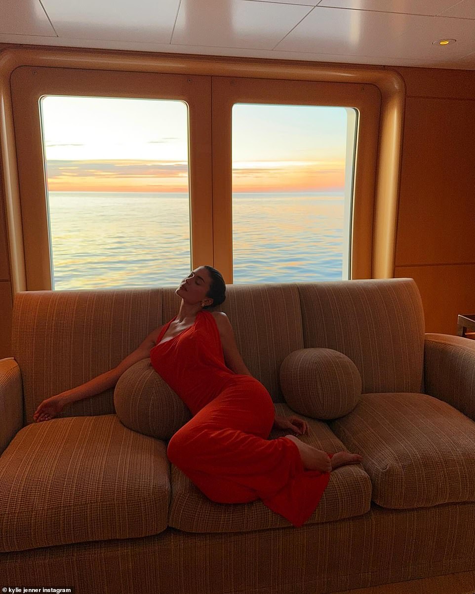 Jenner was also seen shoe-free while lounging on a sofa inside the yacht