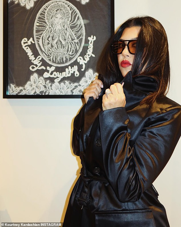 In a new slideshow, uploaded to her account on Tuesday, the 45-year-old reality star could be seen rocking a bright red lipstick and black leather trench coat over a plunging tank top