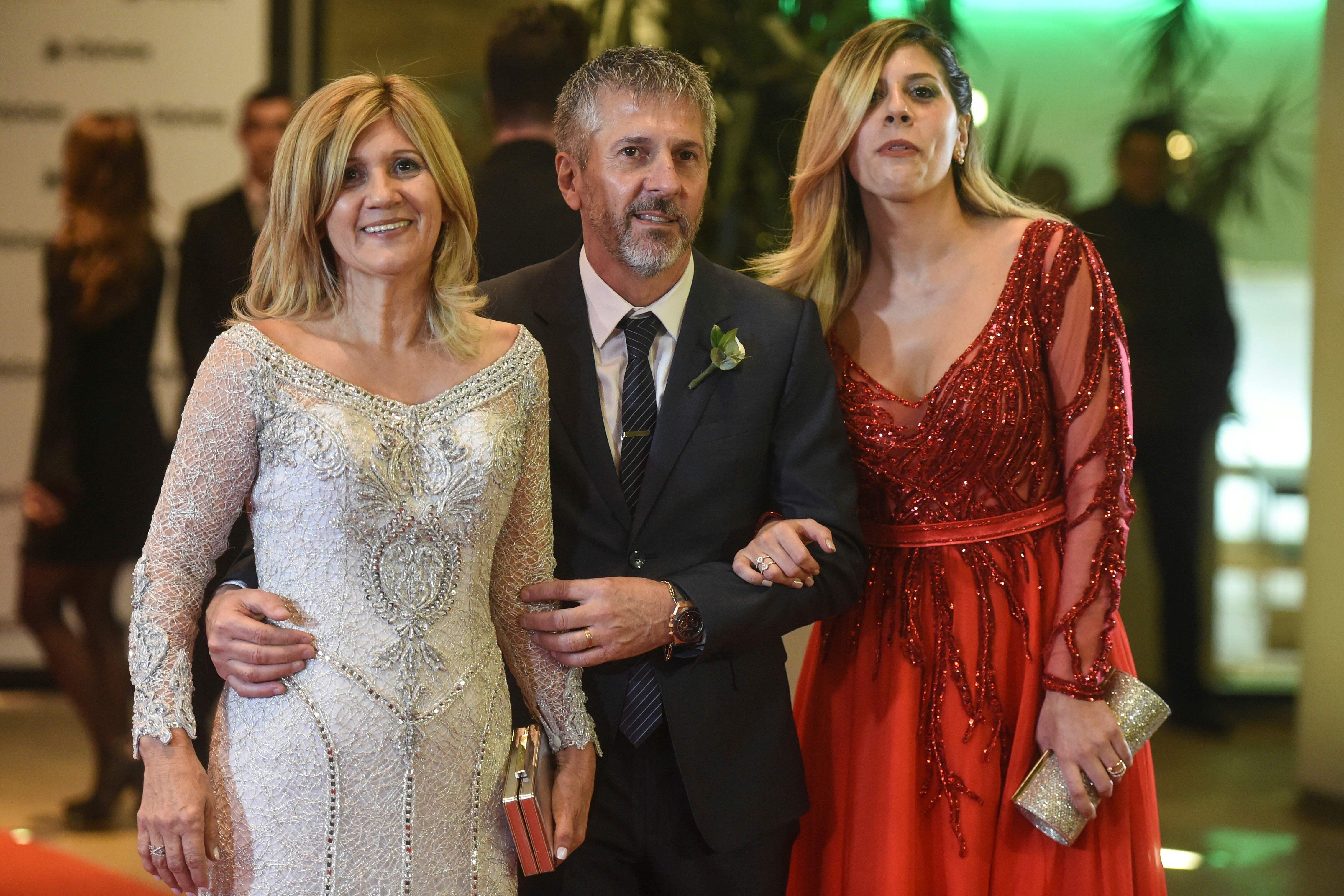 Messi's mum Celia - next to his dad Jorge and sister Maria - wore white to her son's wedding in 2017