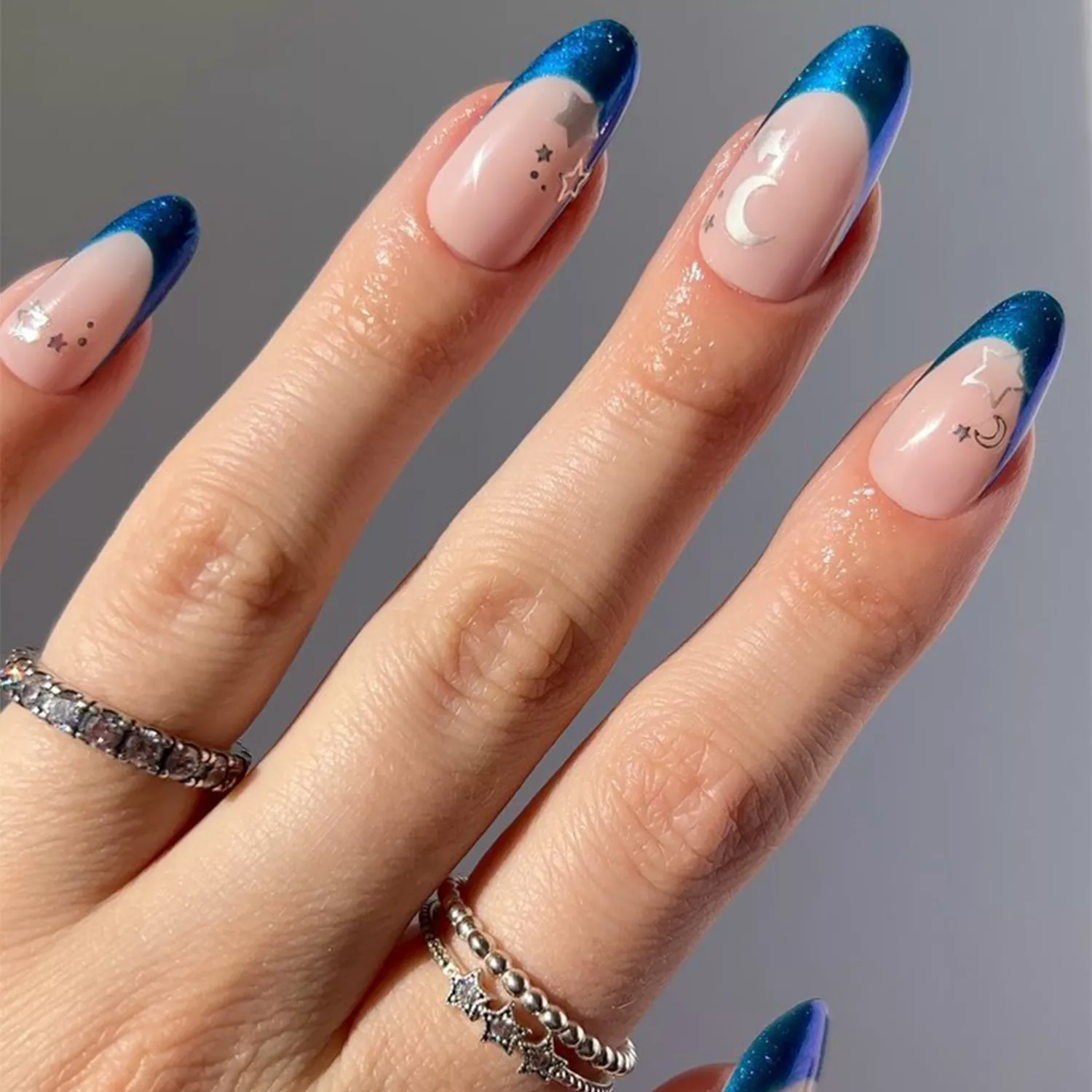 blue french nails with silver nail stickers