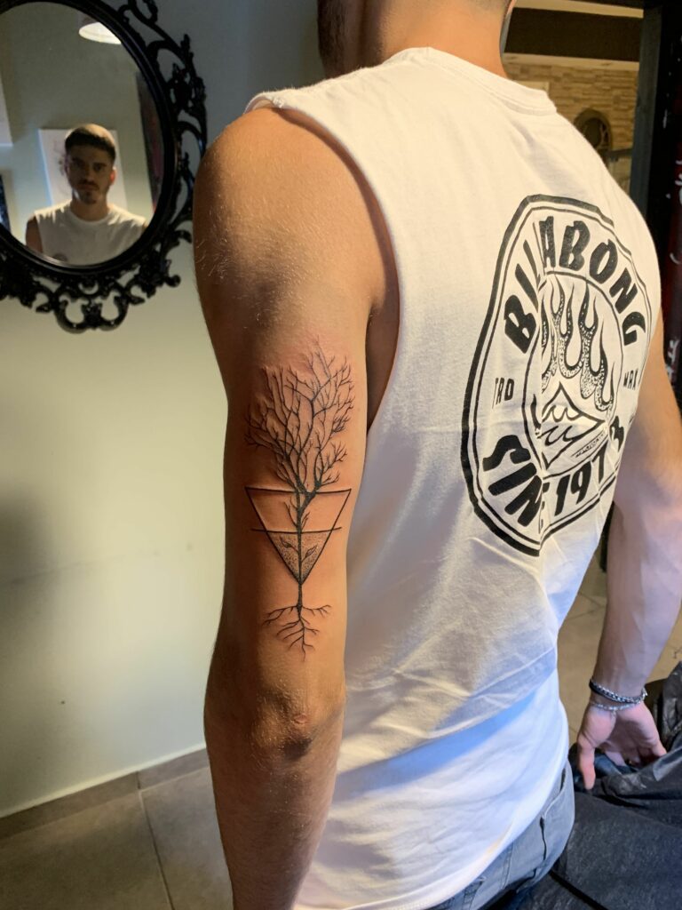 tiny sapling tattoo