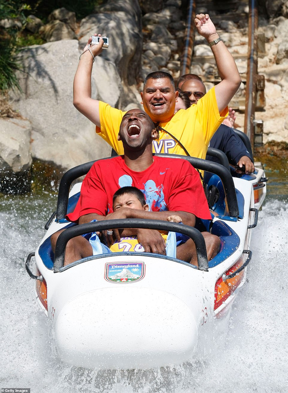 Kobe Bryant's magical family moment: Celebrating the Lakers' NBA championship victory at Disneyland with his wife Vanessa and daughters Natalia and Gianna in 2010