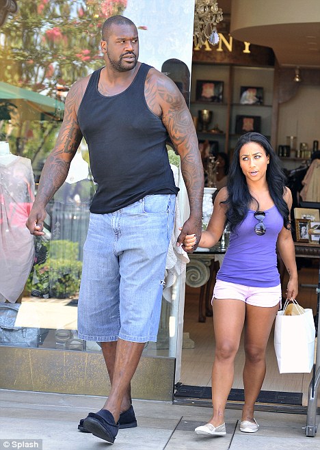 The tall and the short of it: Shaquille O'Neal and Nicole Alexander stepped out to go shopping in Calabasas, California