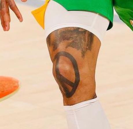 Jordan Clarkson peace tattoo